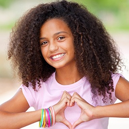 Smiling preteen girl with healthy teeth
