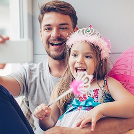 Father and daughter taking selfies