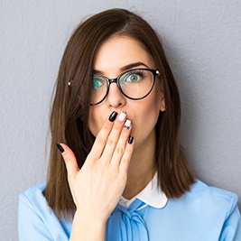 Woman covring her mouth