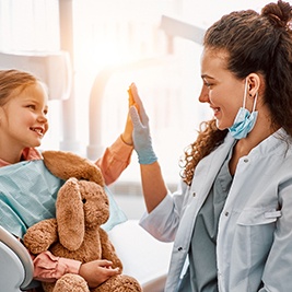 Patient in Auburn smiling during dental checkup and cleaning