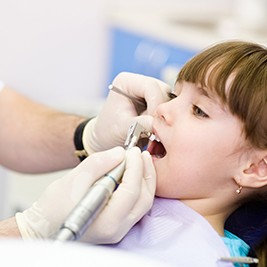 Patient in Auburn smiling during dental cleaning