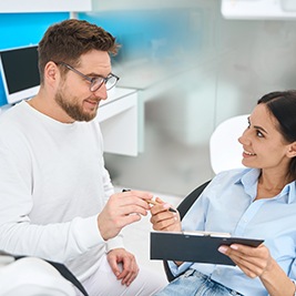 Female patient smiling at her dentist