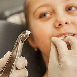 Child having tooth extracted