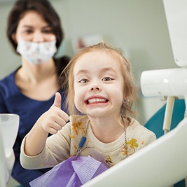 Girl smiling in the dental chair