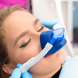 Teen in dental chair with nitrous oxide mask