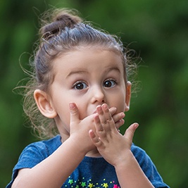 Child covering mouth