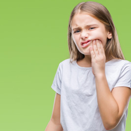 Young girl suffering from a toothache
