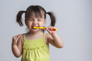 Toddler brushing teeth