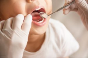 Child visiting their Auburn pediatric dentist for checkup