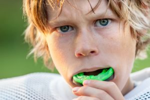 Young boy wearing an athletic mouthguard