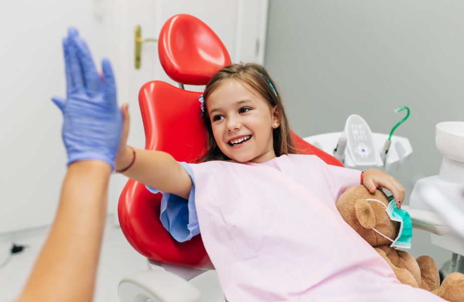 Little girl high fiving dentist